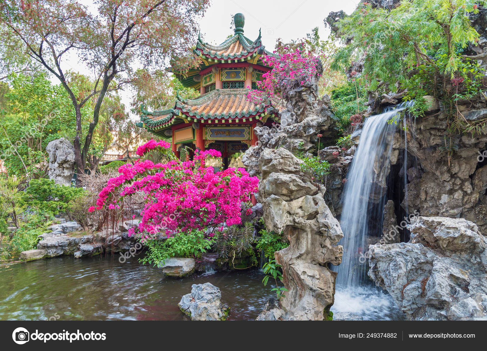 pavilion and waterfall in oriental garden in hong kong