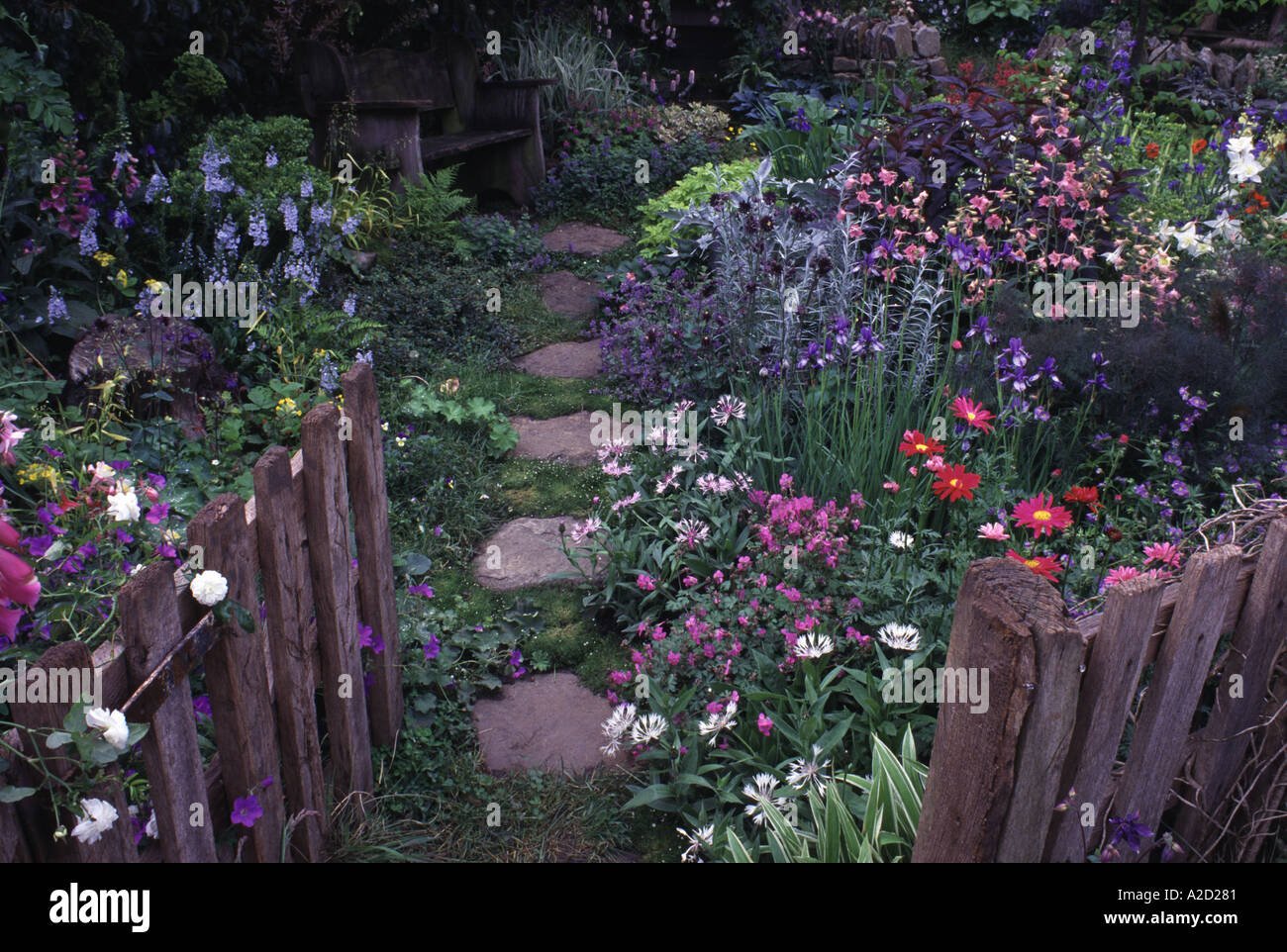 cottage planted garden looking through gate chelsea flower show 2002