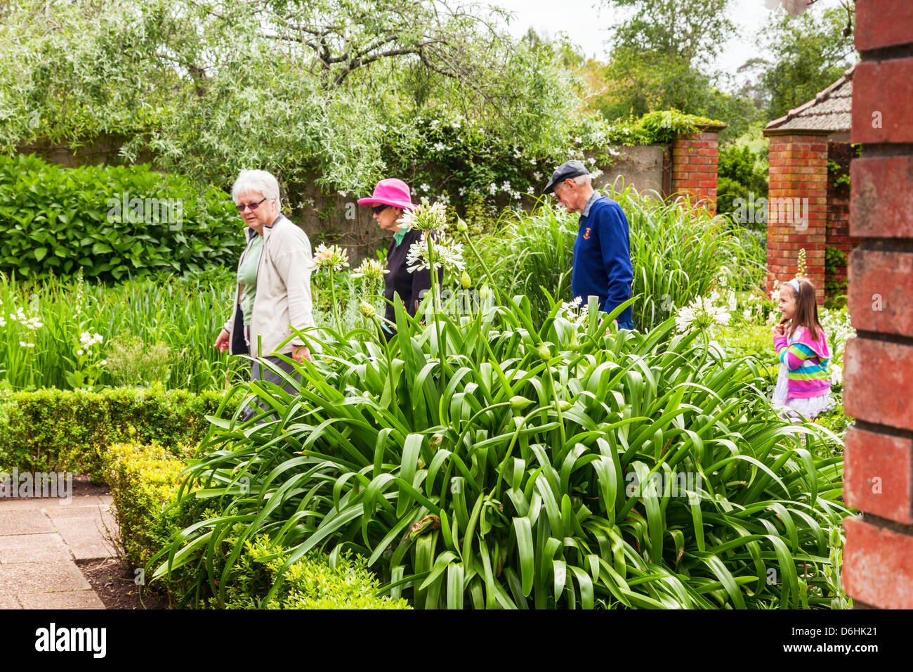visitors looking around the english flower garden, hamilton gardens