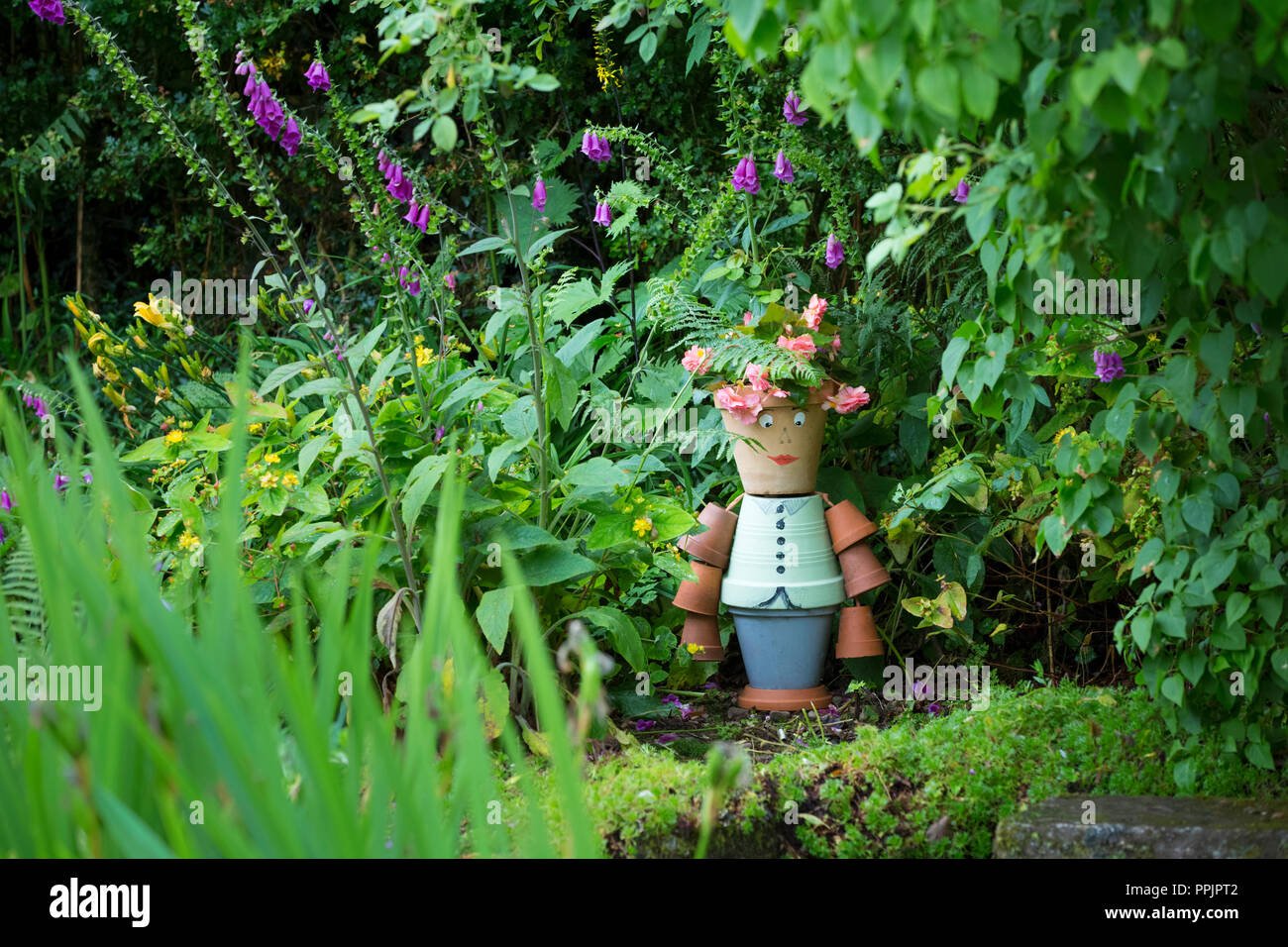 flower pot man made from terracotta pots stock photo: 220459906 - alamy