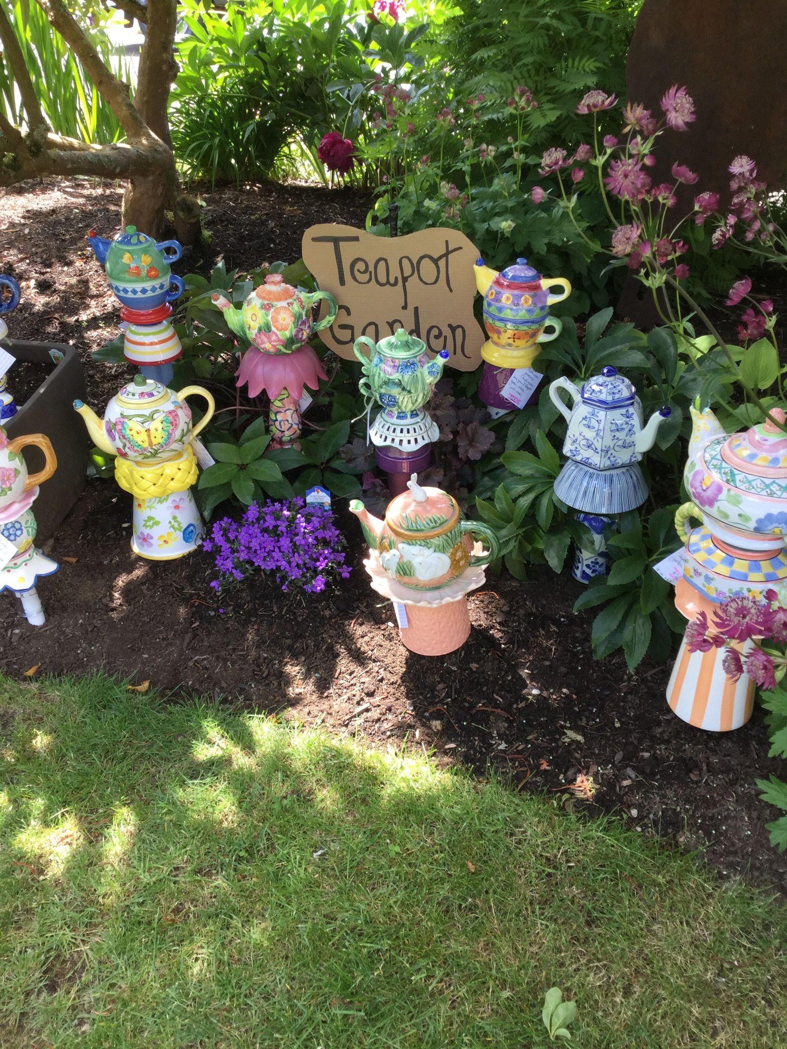 a teapot garden | yard art | glass garden art, glass garden, garden