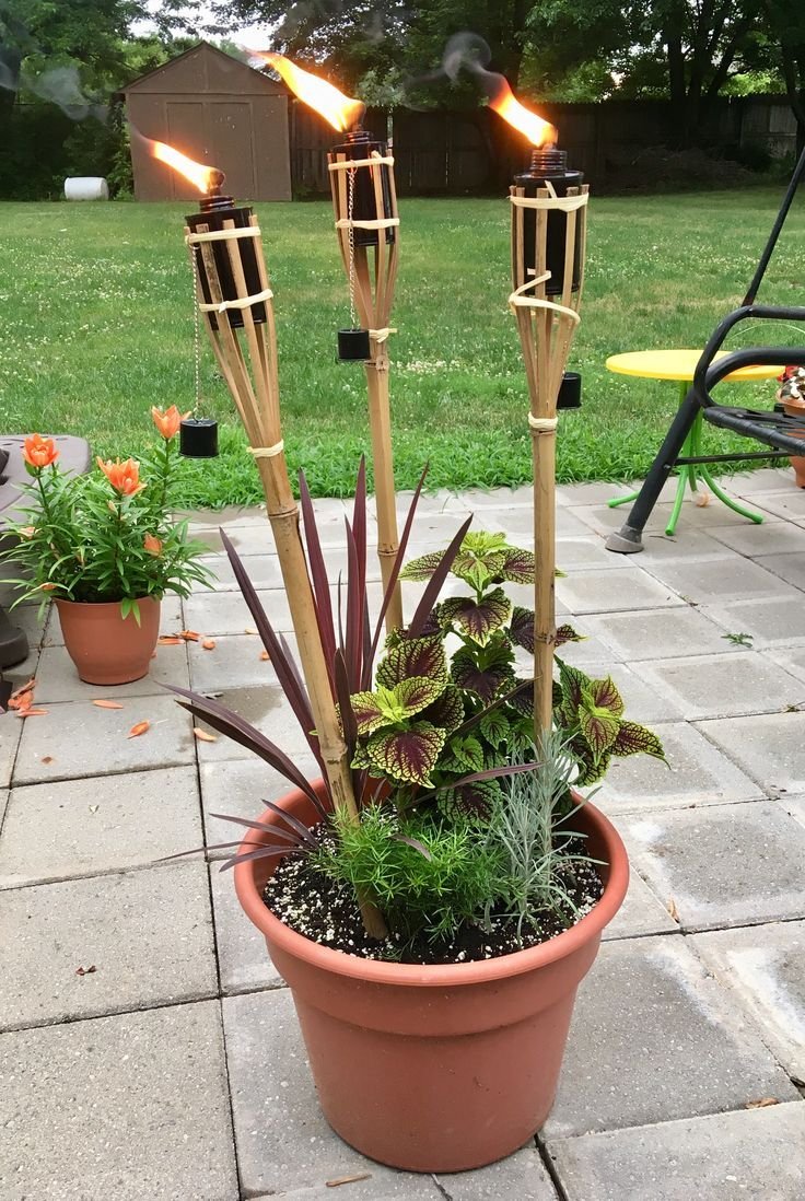 tiki torch planter | backyard landscaping designs, landscape design