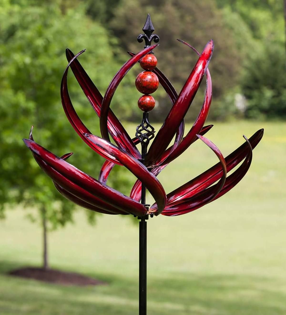 crimson lotus wind spinner stands more than 7 feet tall, making a