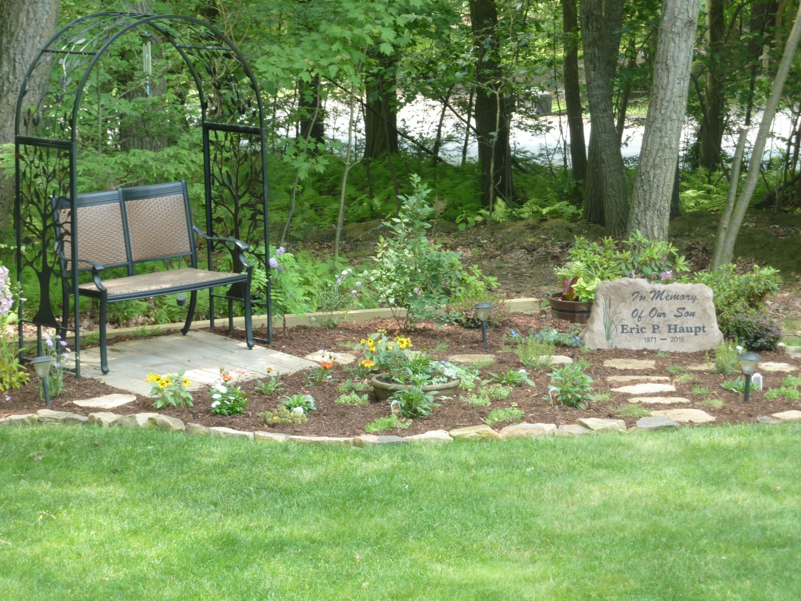 our memorial garden for our son, featuring a custom made stone