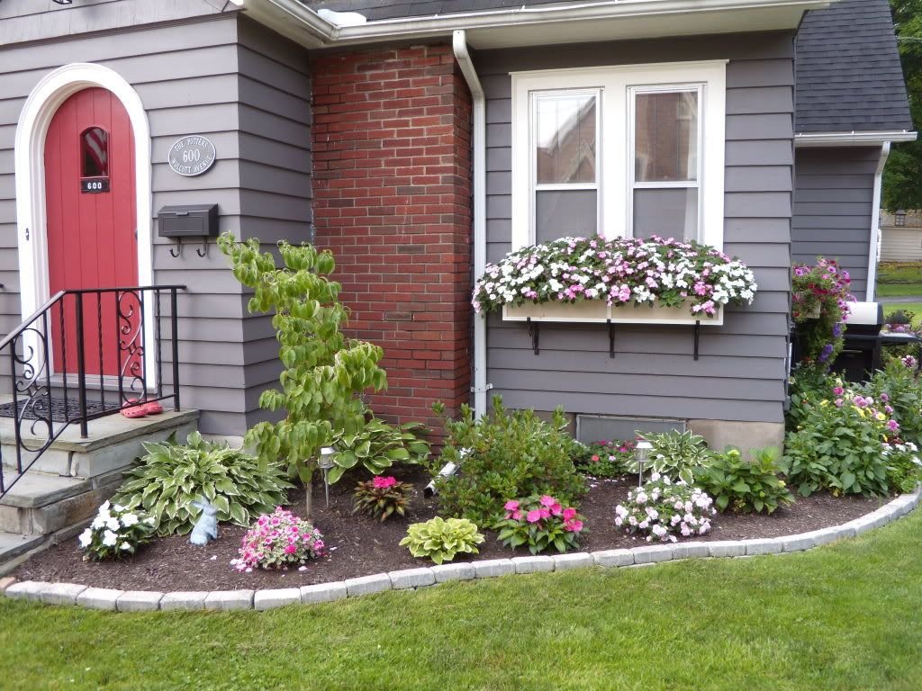 front of house flower bed idea.maybe a redo sooner than later i