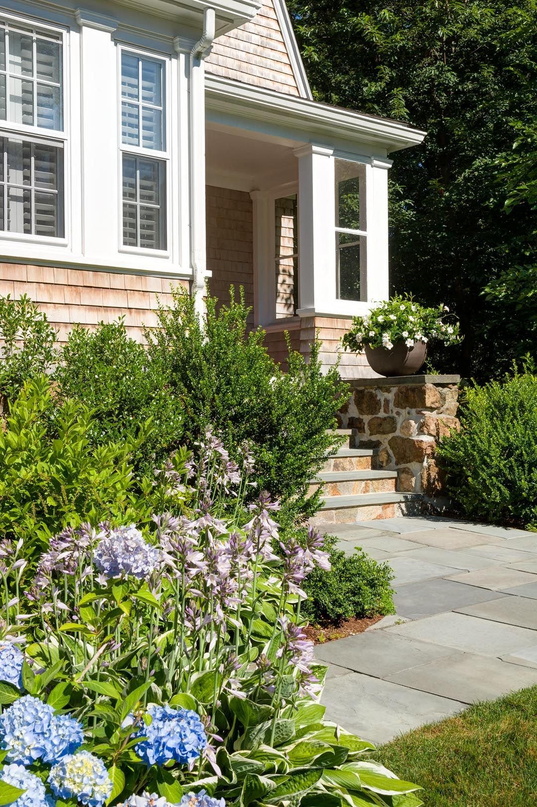 low terracotta bowl accent on a classic new england home stoop
