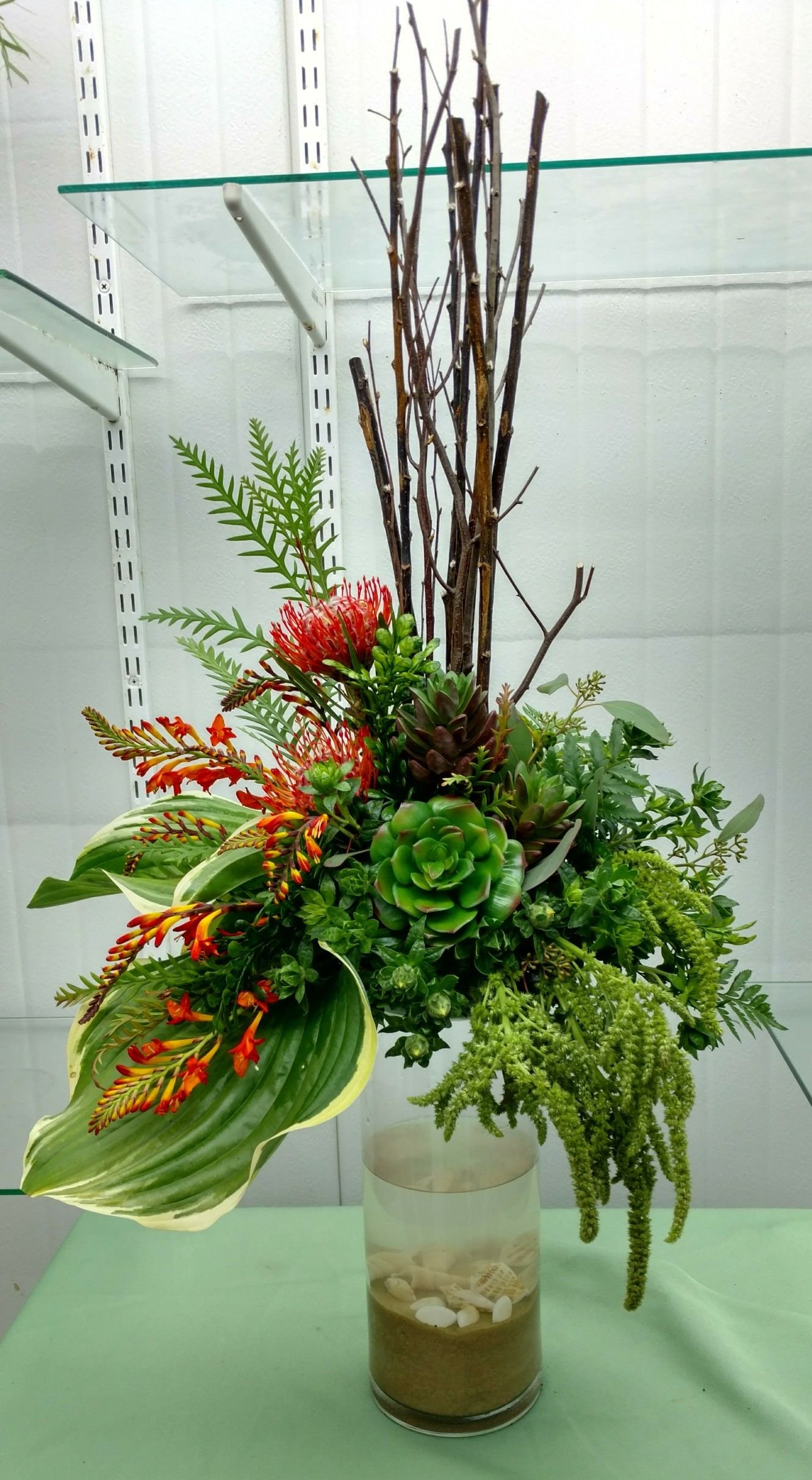 silk succulents mixed with live floral. by s. henry, garden of eden