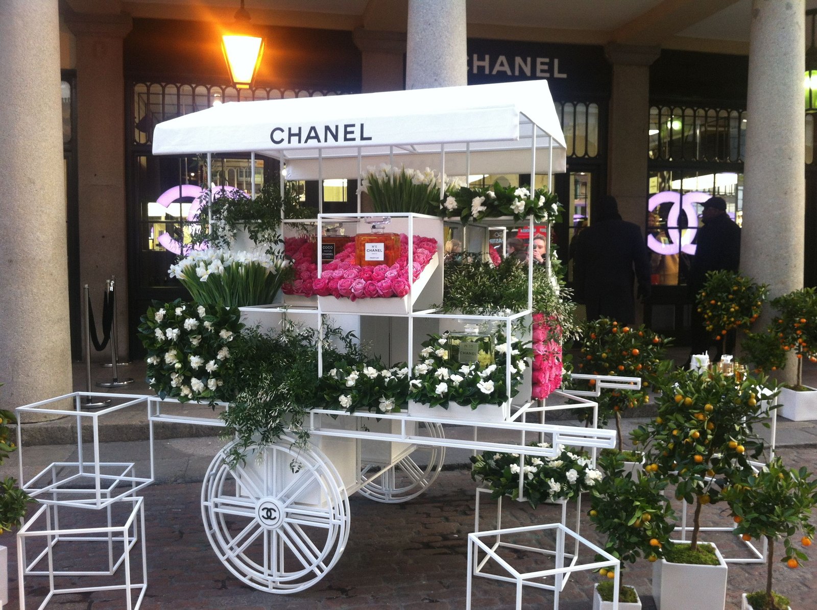 chanel shop covent garden. flowers and perfume being sold from