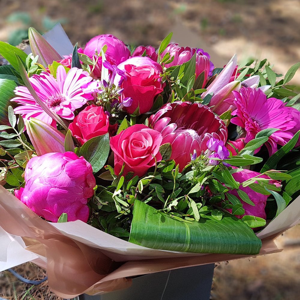 hot pink hand-tied created by lamberts flower company, welwyn garden